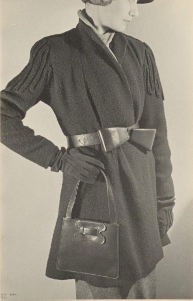 Model with wool coat and purse