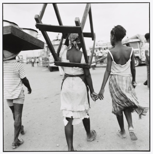 Port-au-Prince (Woman Carrying Wood Structure on Shoulders, Holding Hand of Another Woman)