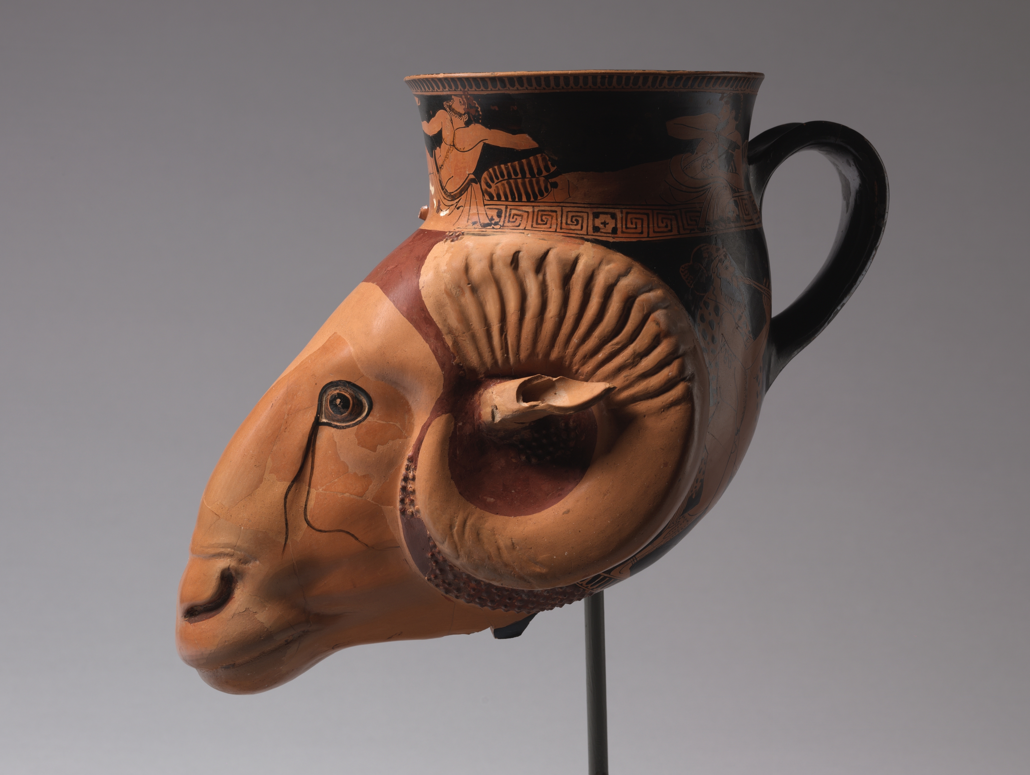 Red-Figure Ram-Head Rhyton (Drinking Vessel): Symposiasts; Satyr and Maenad