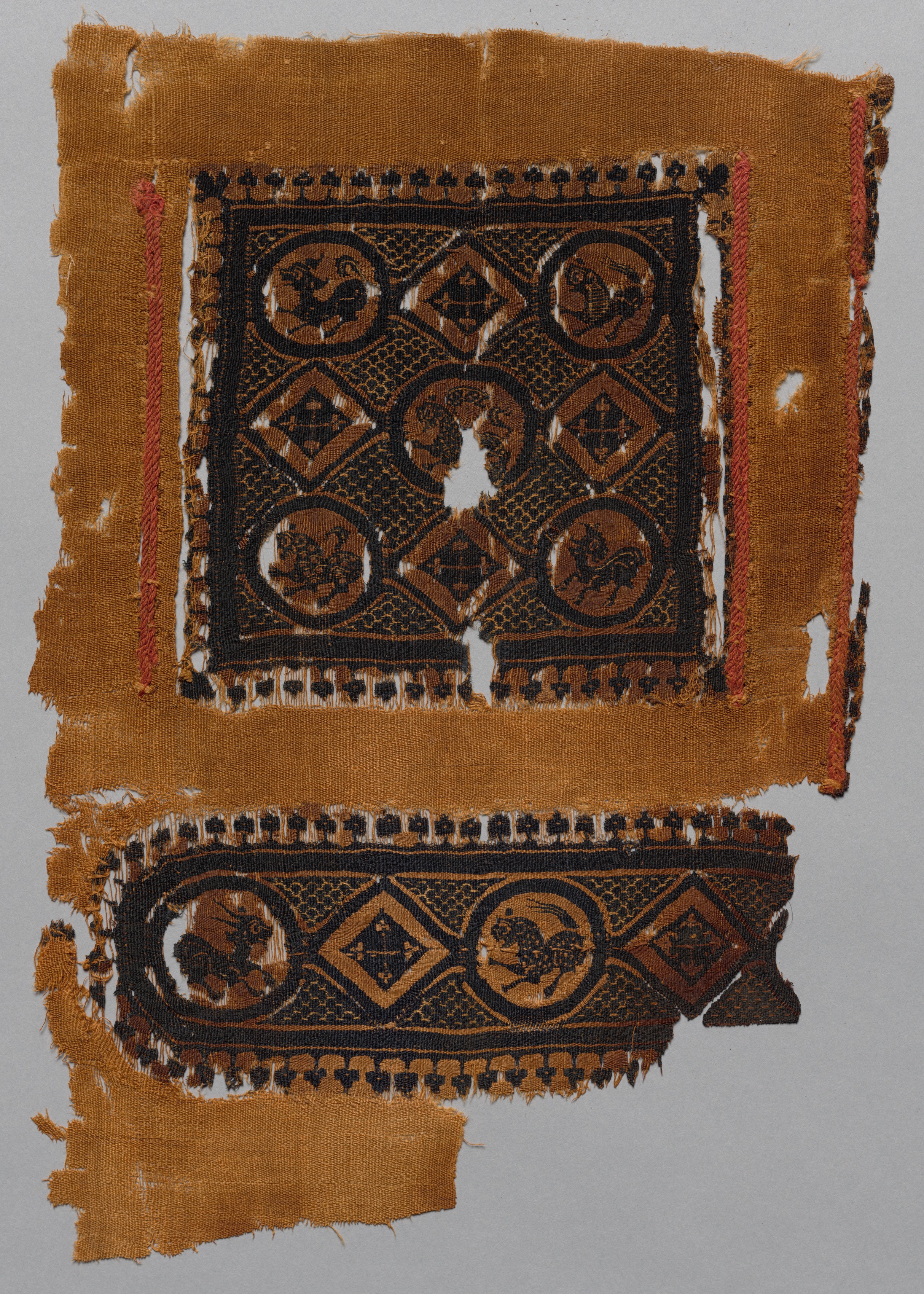 Fragment of a Tunic with Segmentum and Part of a Gammadion Border