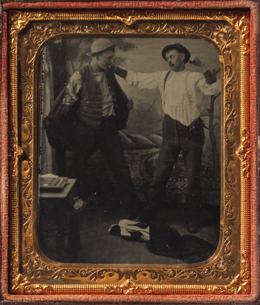 Two Men Staging a Fight in a Studio