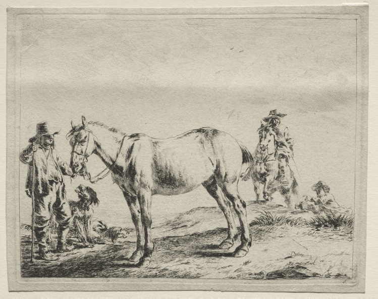 Man holding a horse by the bridle