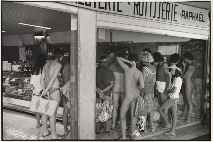 Crowd of nudists at rotisserie, Côte d'Azur, France