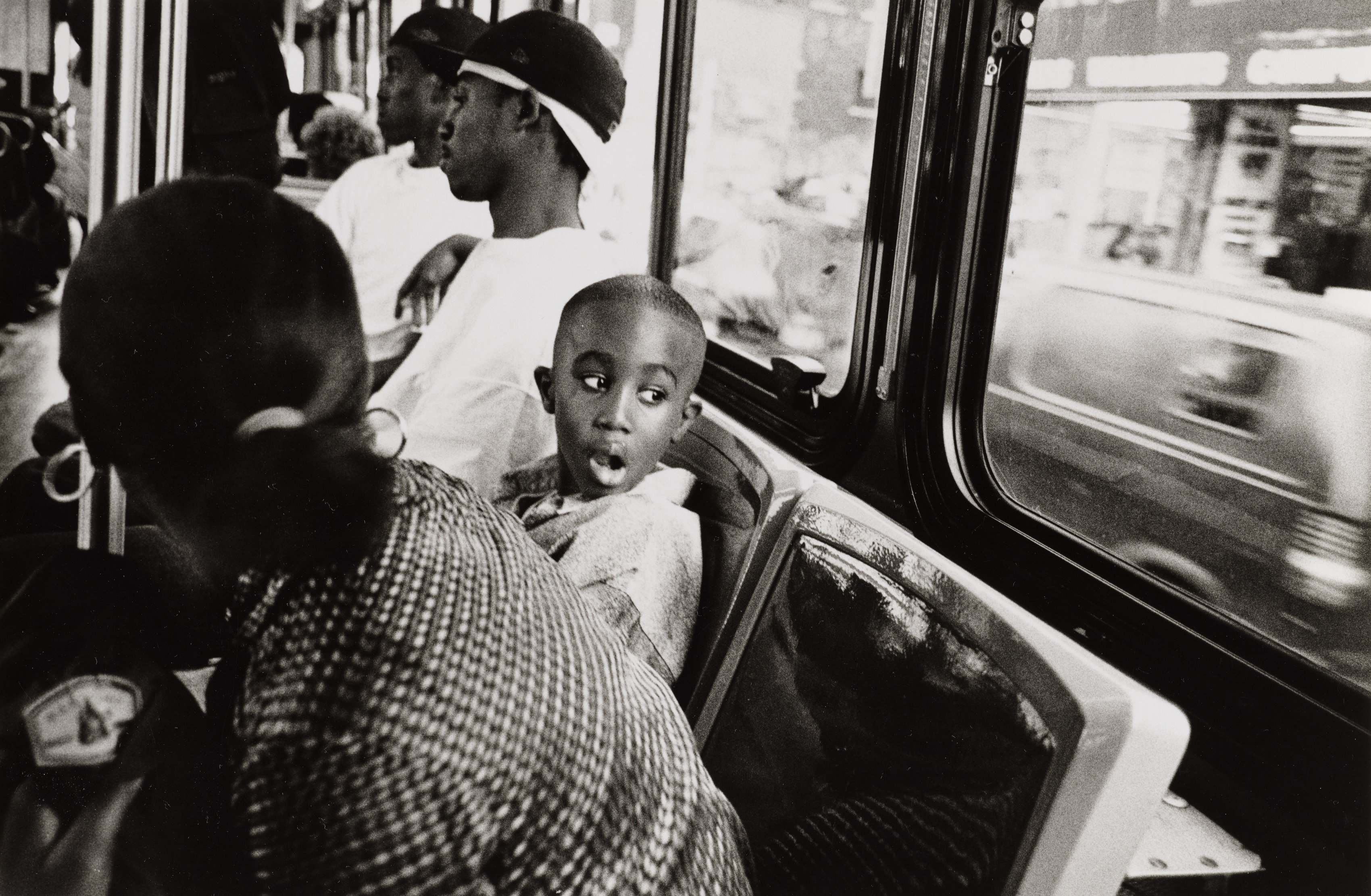 Boy Sitting on Bus Looking Out the Window, Bronx, New York City