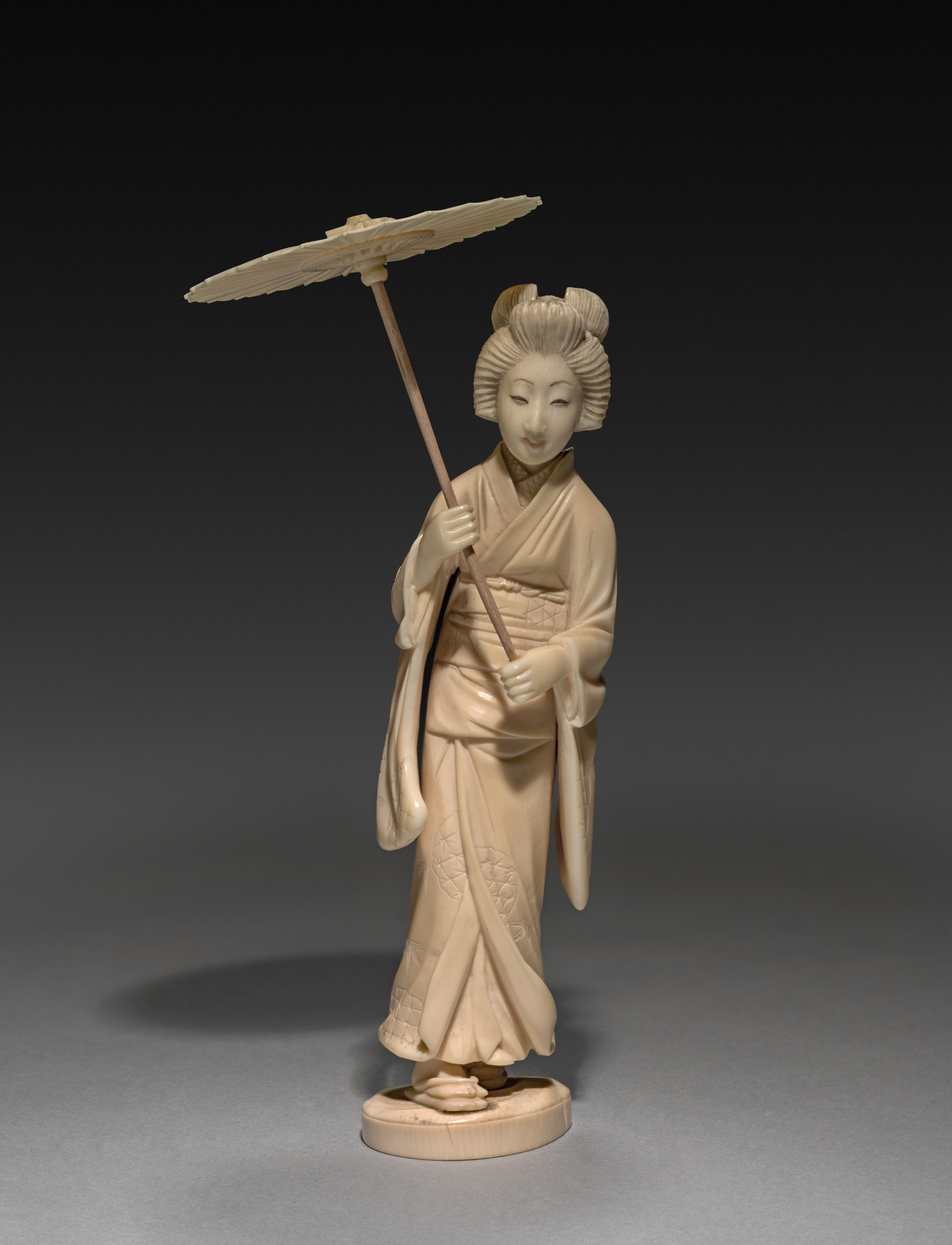 Woman Carrying a Parasol