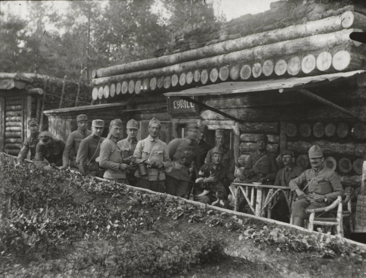 Soldiers Relaxing at Log-Cabin Style Building 
