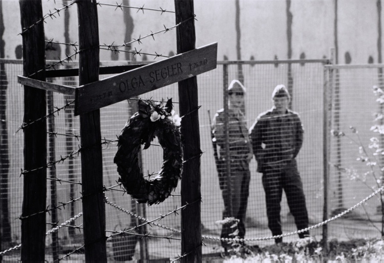 Berlin Wall Patrol Guards Seen Behind a Wooden Grave Marker
