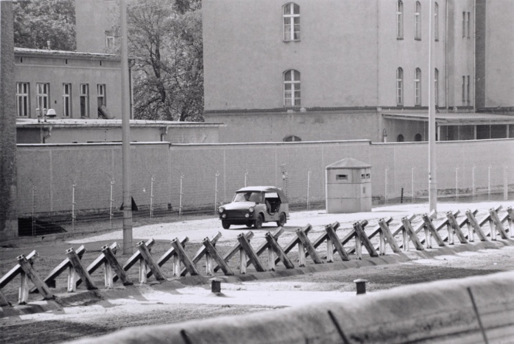 Berlin Wall patrol guards driving a car