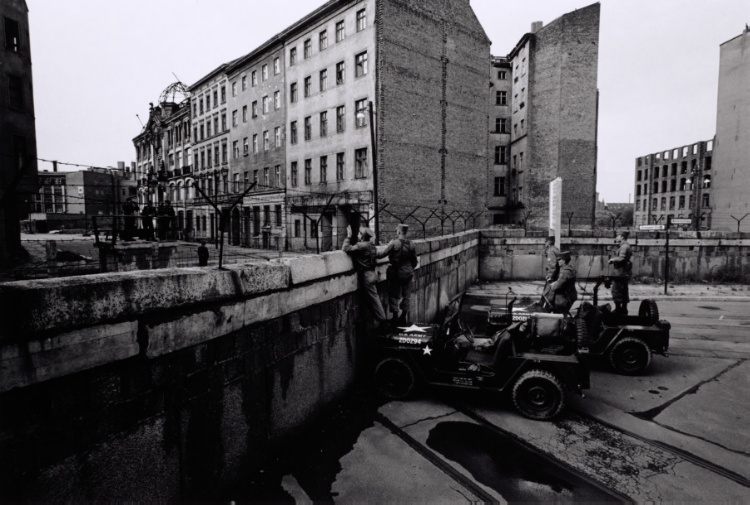 Patrol guards and military vehicles stationed on the Berlin Wall