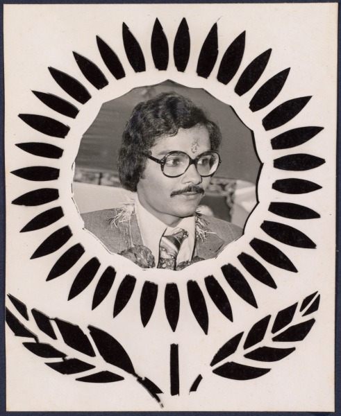 Untitled (portrait of a man with glasses and mustache set into flower design)