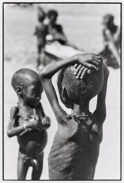 Famine, Half Dead Children, Europeans Trying to Help: A French military mission has arrived to bring strategic aid. Entire villages have been decimated. That is how Karamoja province in the north of Uganda looks today. Boy holding gun, Uganda