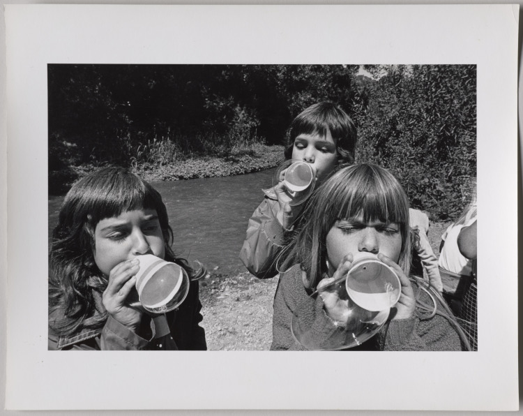 Young Girls Blowing Cup Bubbles Near a Stream, Tri-Valley Area, Northern California