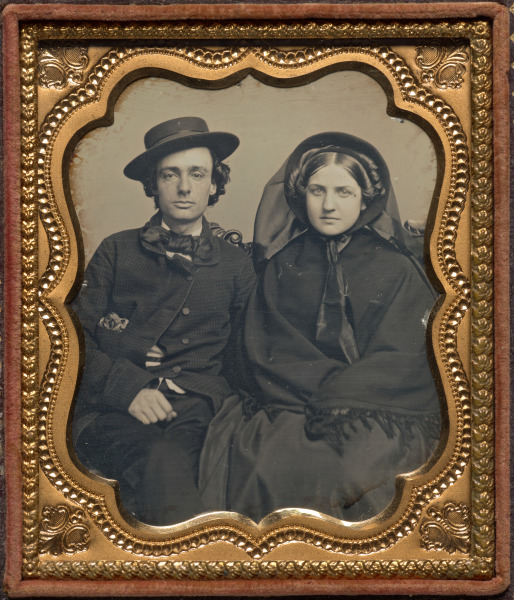 Seated couple in mourning attire