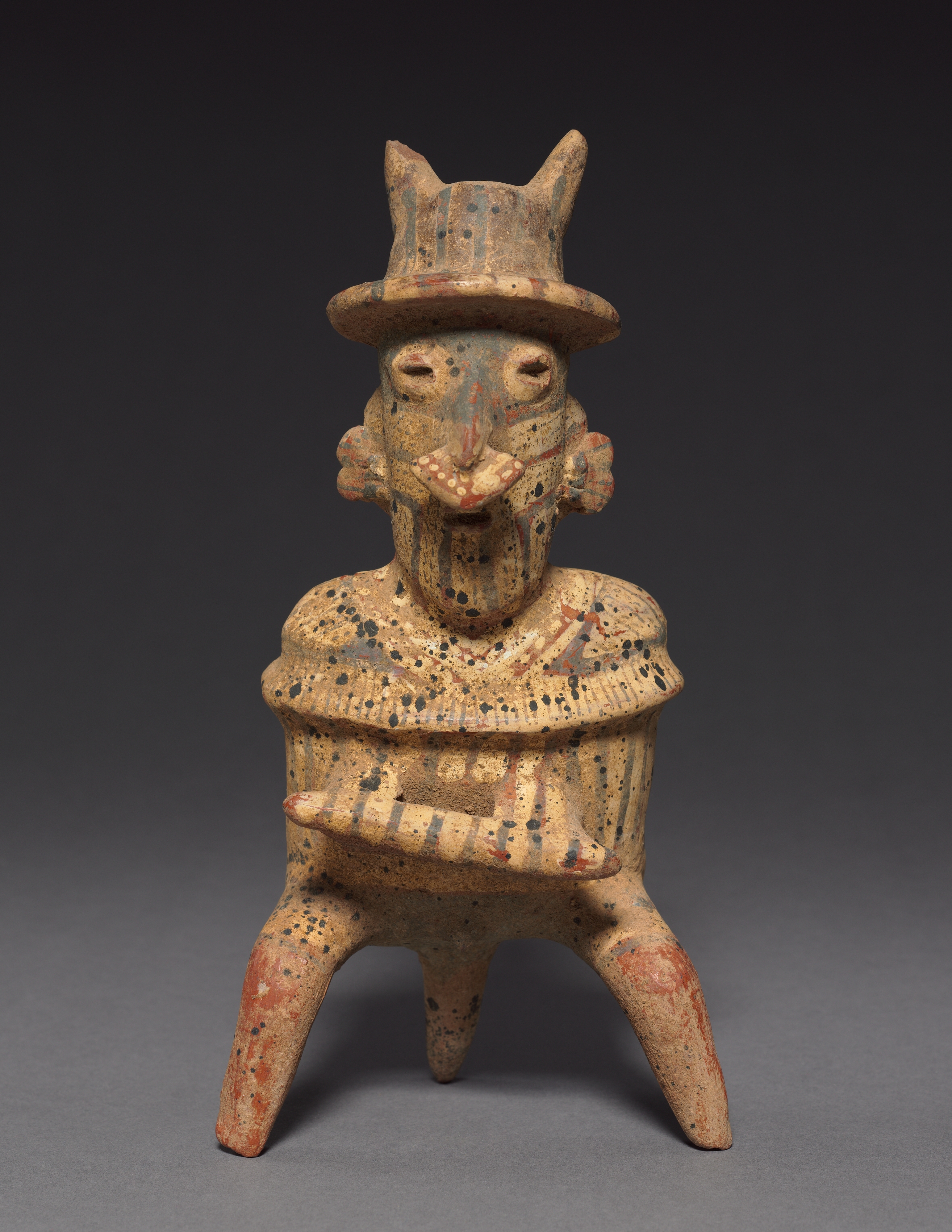 Seated Male Holding Chief’s Baton