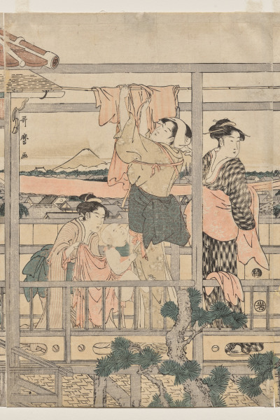 Women Hanging Laundry to Dry on a Balcony