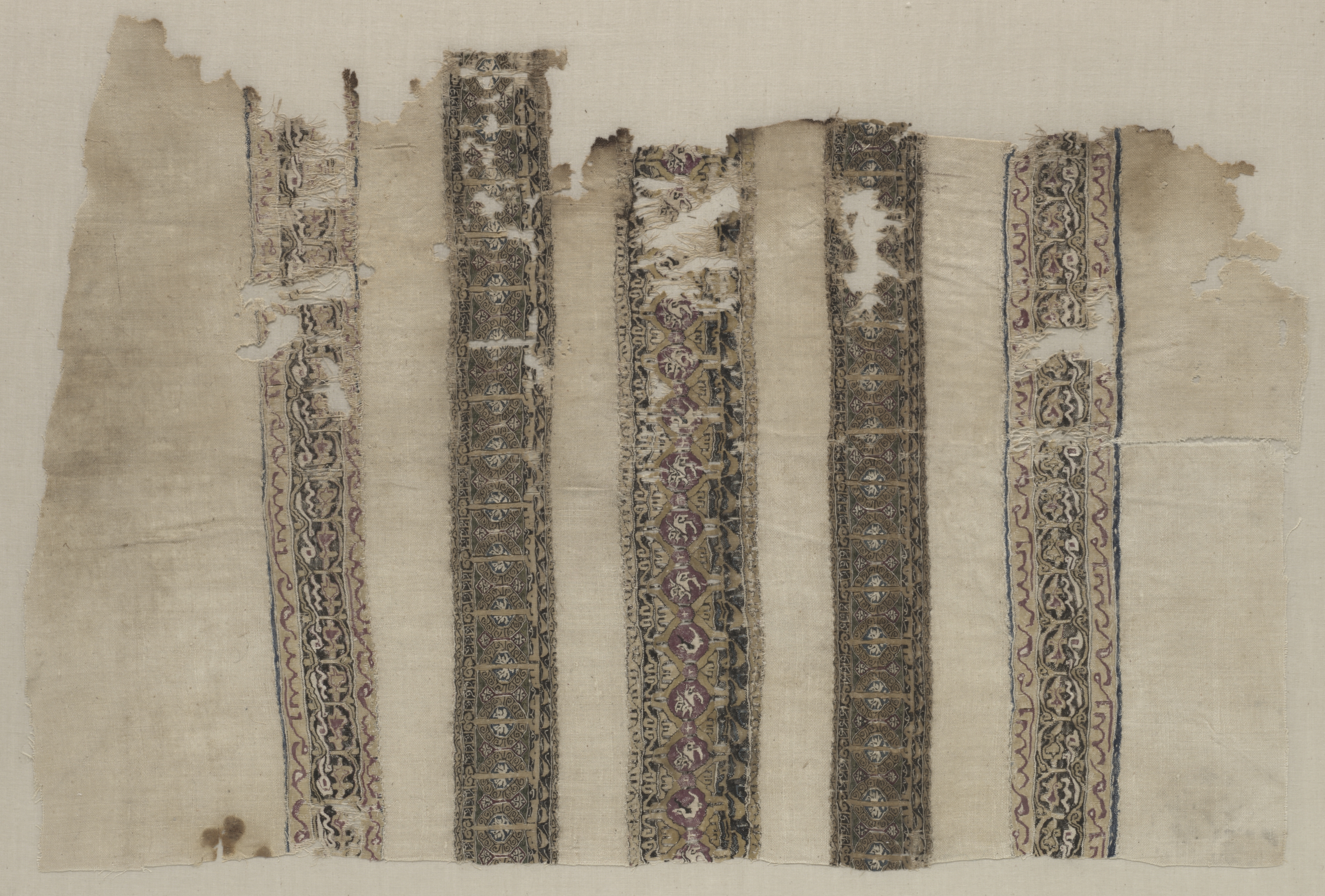 Fragment Composed of Parts of Three Tiraz-Style Textiles