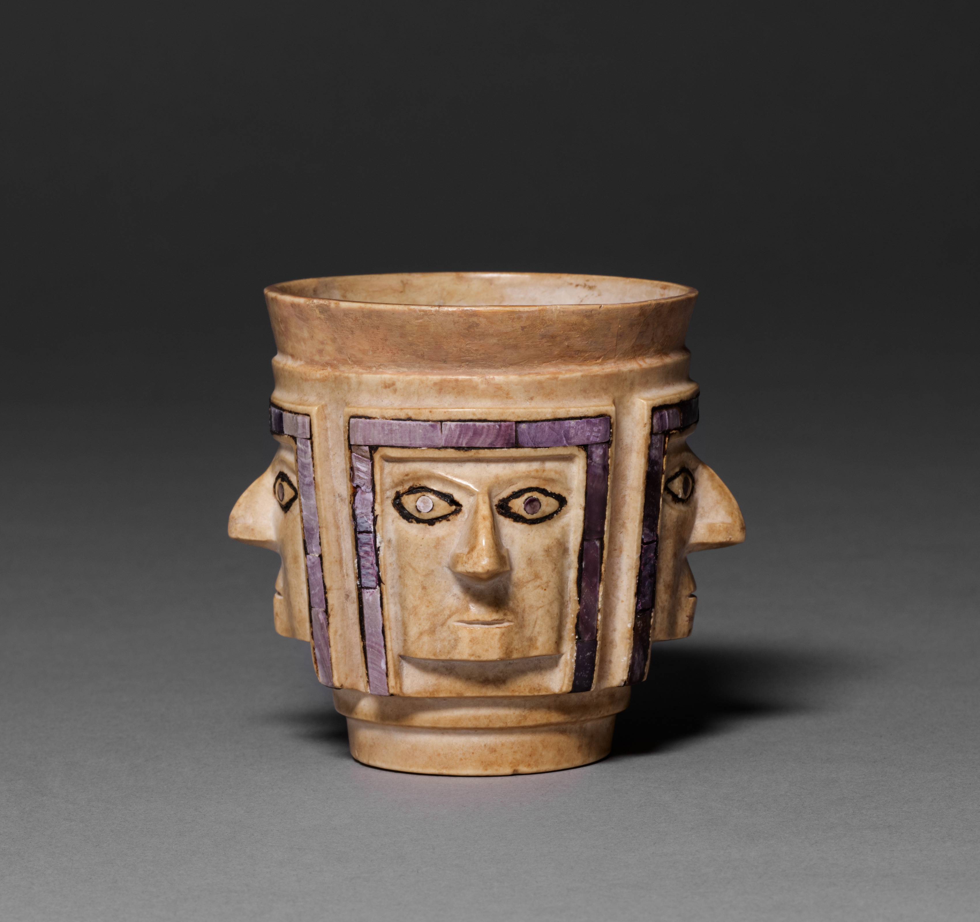 Cup with Four Faces