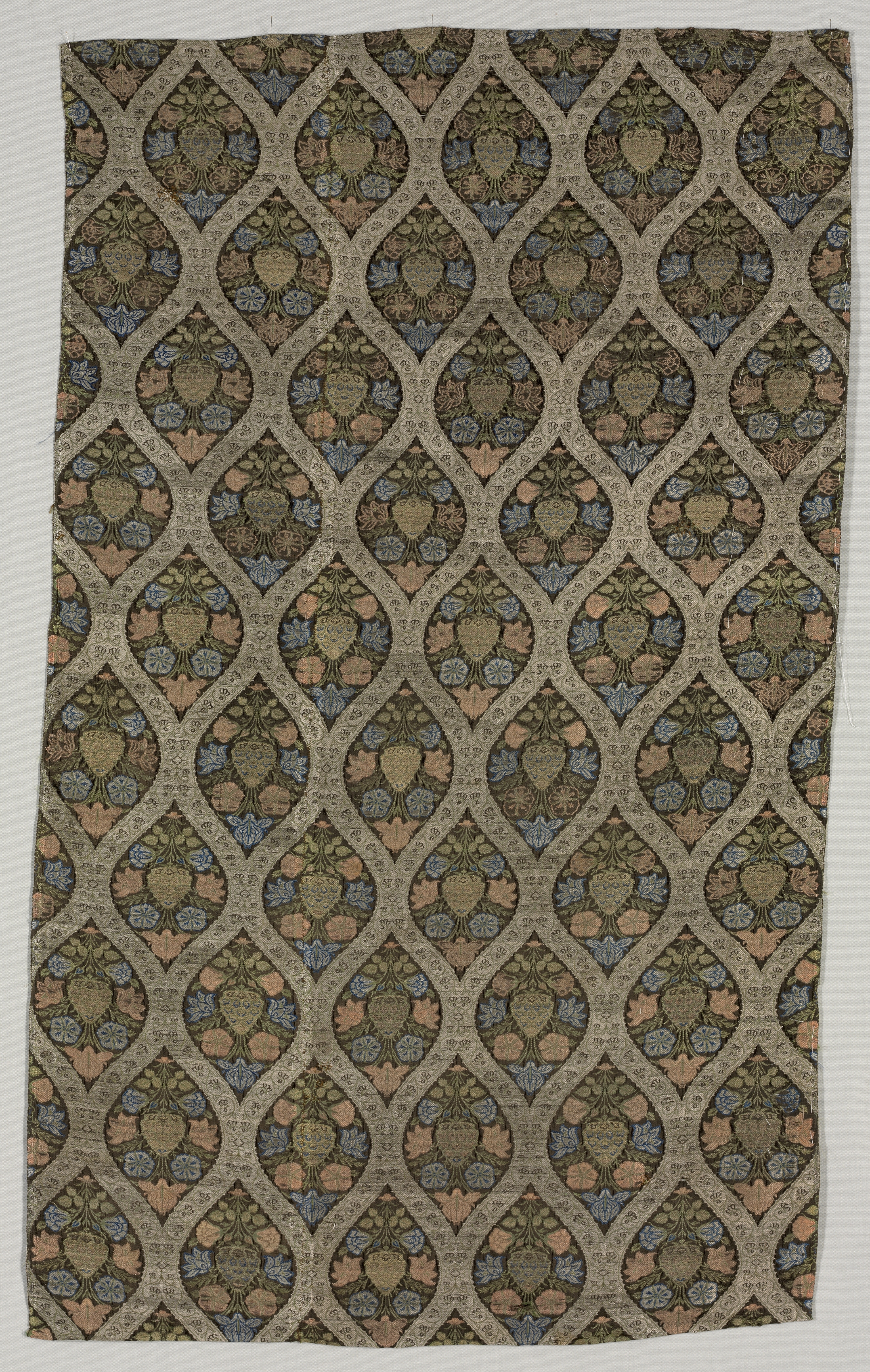 Lampas fragment with blossoms in ogival lattice