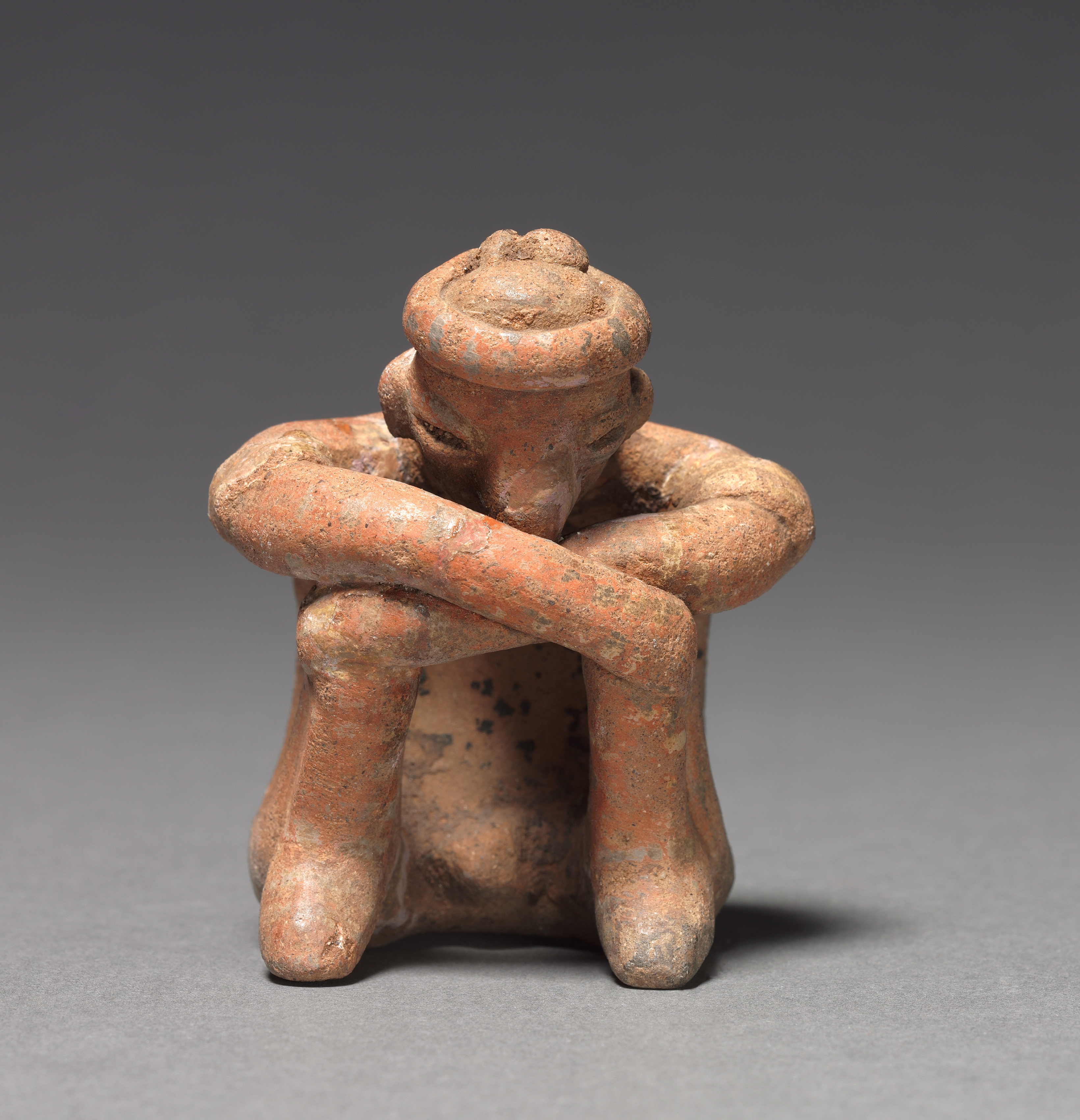Seated Male Figurine