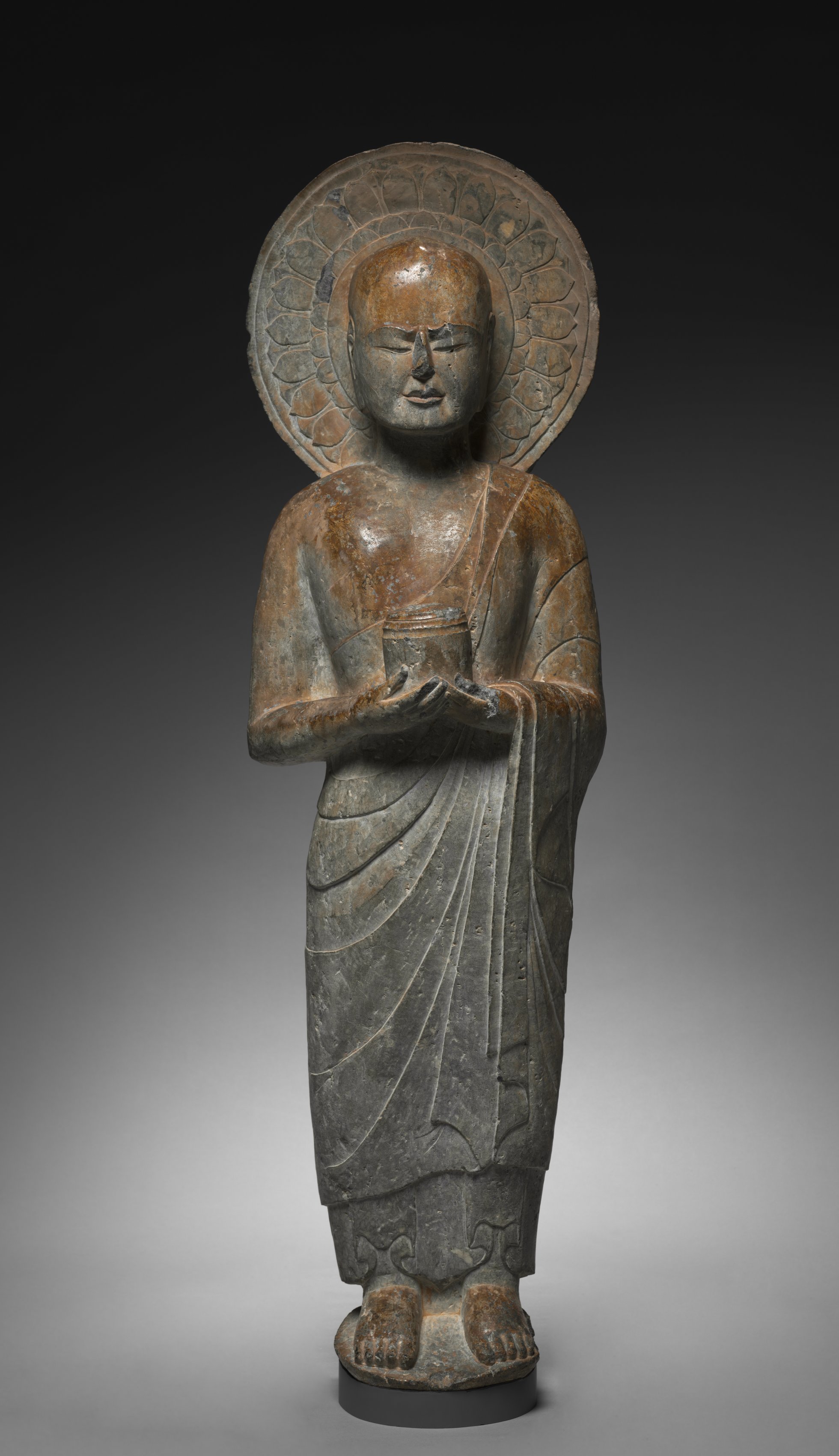 Standing Disciple Mahakasyapa Holding a Cylindrical Reliquary