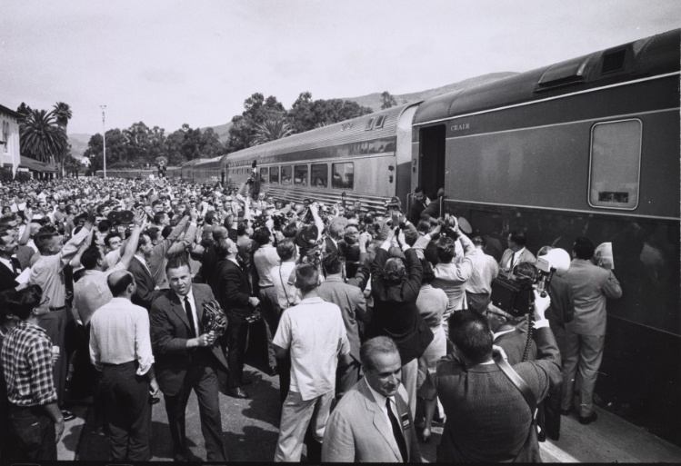 Khrushchev boarding a train, large crowd present