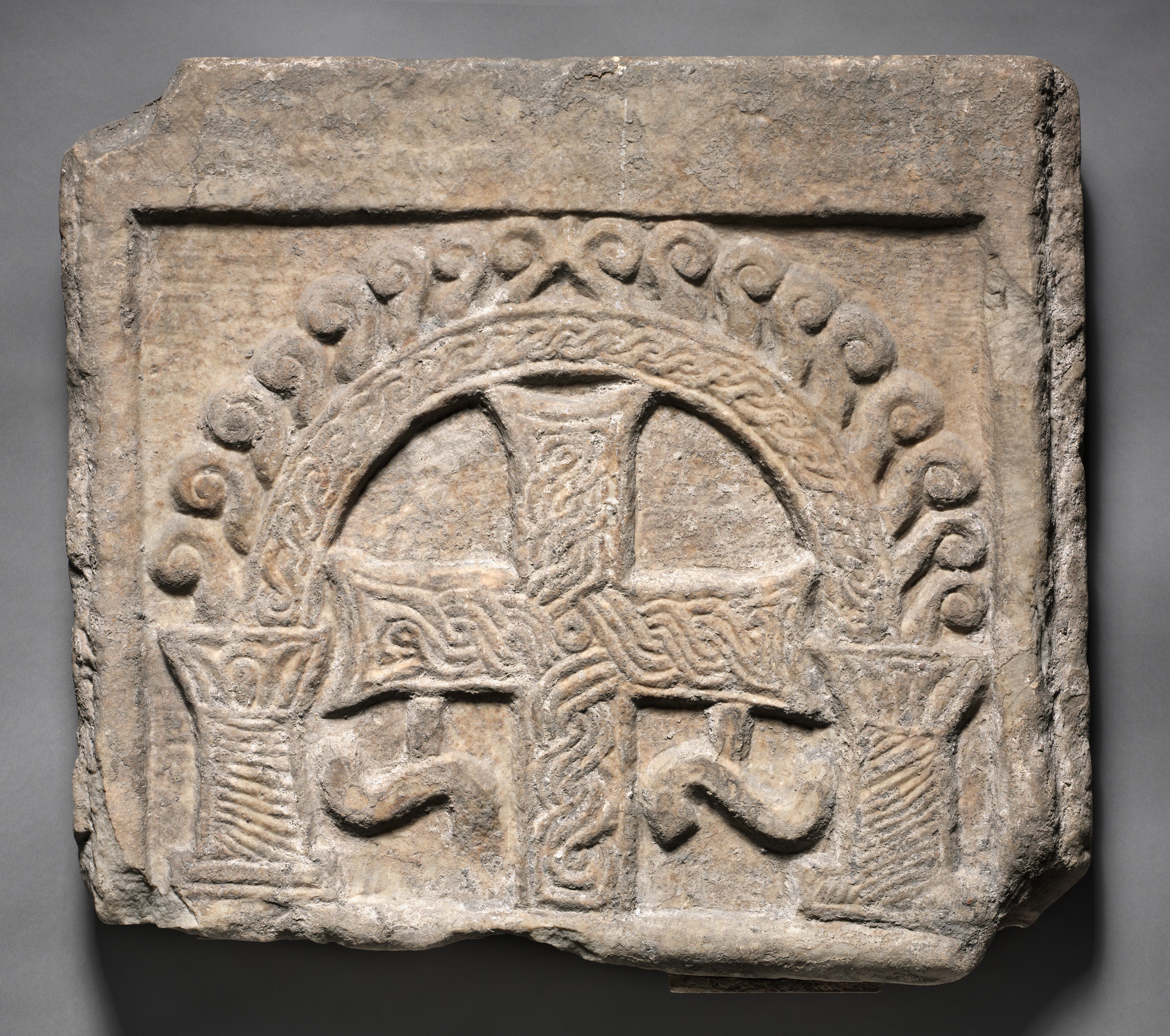 Relief Panel from the End of a Sarcophagus:  A Cross Within an Arch
