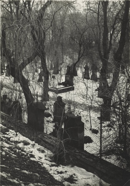 Graveyard in Winter Seen Behind Barbed-Wire Fence