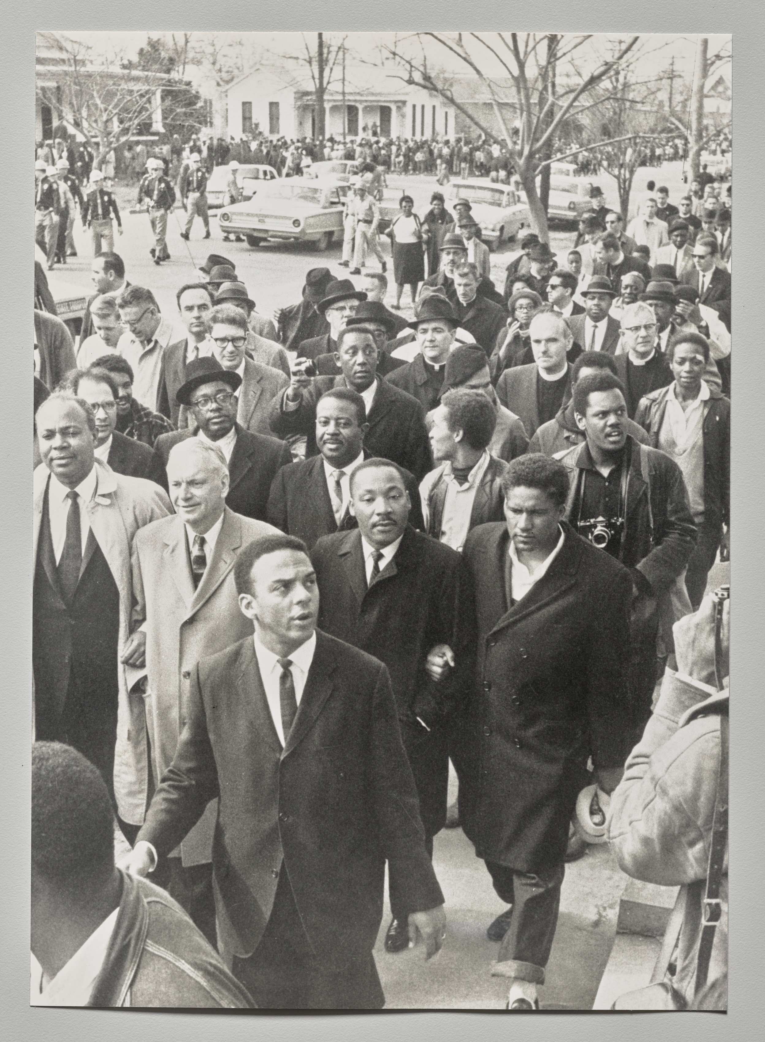 Civil Rights March: The Reverend Andrew Young, foreground, wearing tie, precedes Dr. Martin Luther King Jr., first row, second from right, as civil rights activists and clergymen (including James Forman, James Farmer, Ralph Abernathy, and Charles Evers) conducted a second protest march in Selma, Alabama. King led about 2,500 marchers out on the Edmund Pettus Bridge and held a short prayer session before turning them around, thereby obeying the court order preventing them from making the full march. March 9, 1965