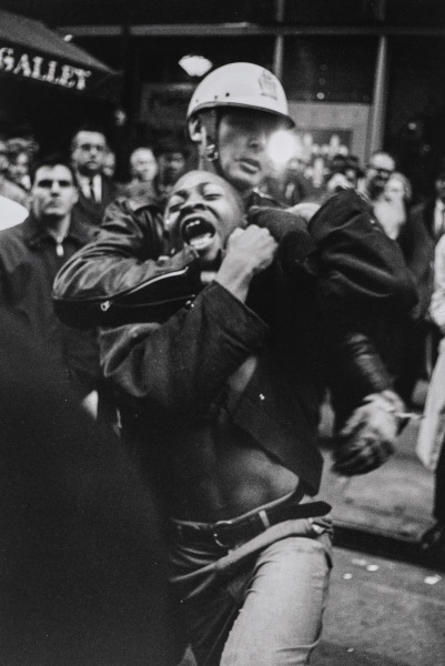 Seventeen-year-old honor roll student Taylor Washington's eighth arrest is immortalized as he yells while passing before me. The photograph became the cover of SNCC's photo book, 'The Movement,' and was reproduced in the former Soviet Union in Pravada, captioned 'Police Brutality USA,' Atlanta