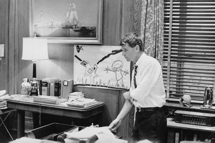 Attorney General Robert F. Kennedy in His Office with Child's Painting on Wall, Washington, DC