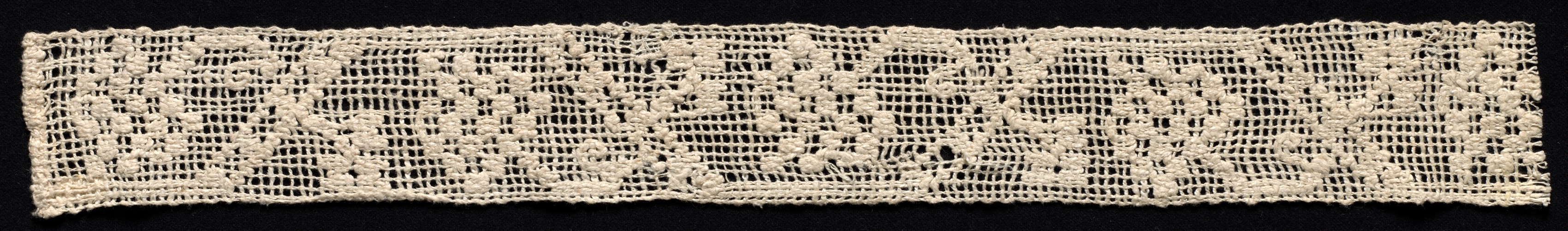 Fragment of a Band with Geometric Pattern and Floral Motif