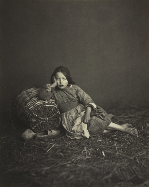 Young Girl Seated on Straw, Leaning on a Basket
