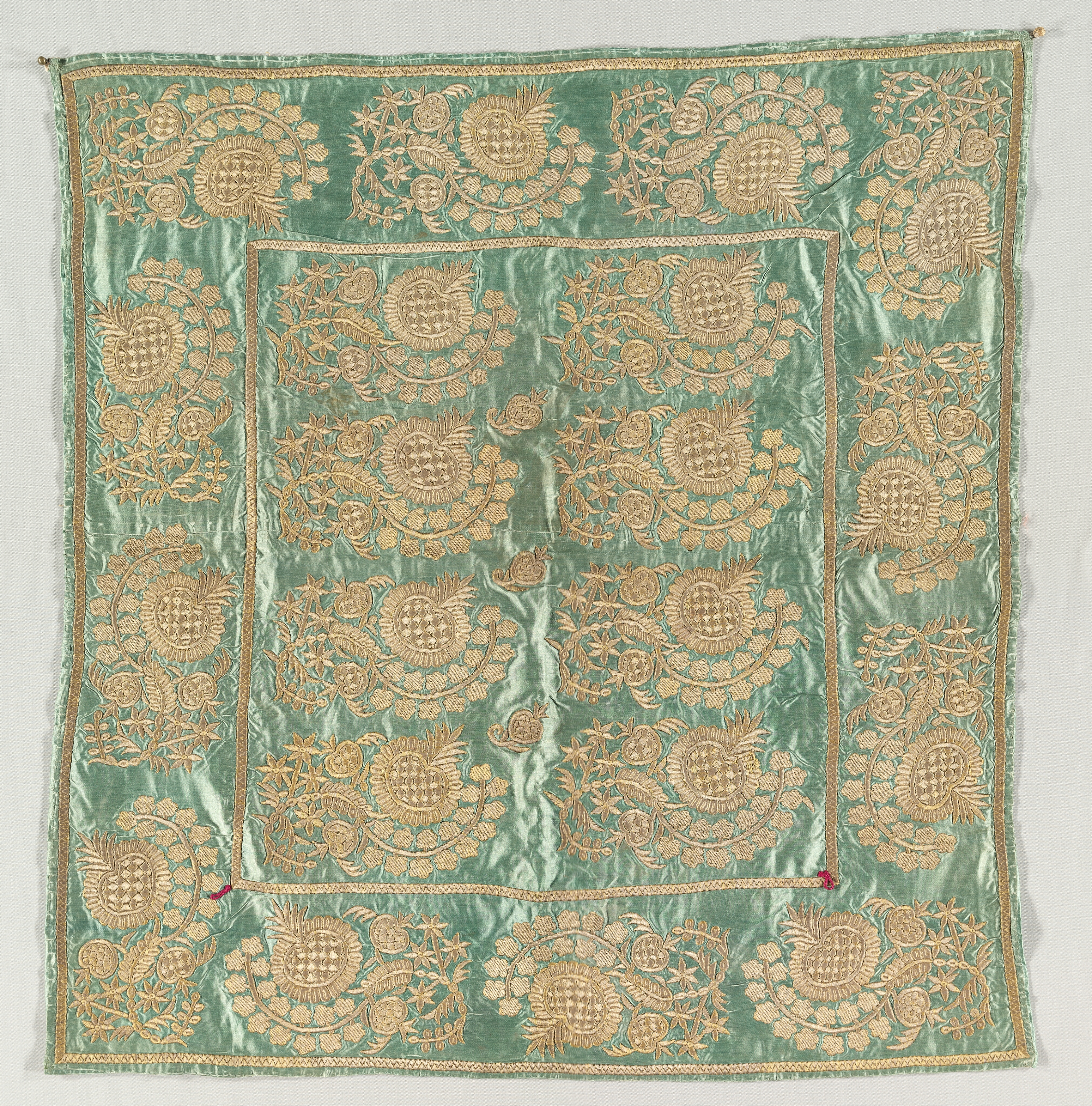 Embroidered envelope with closures