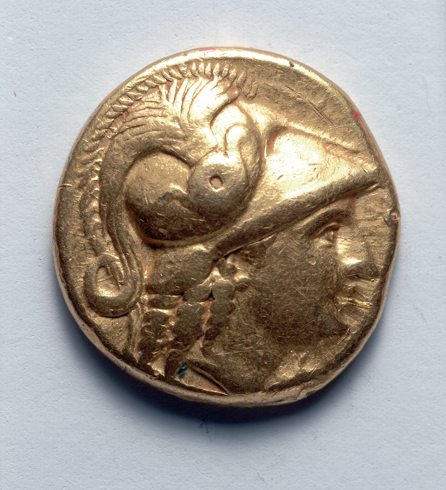 Stater: Head of Athena, r., with crested Corinthian helmet, barley left (obverse)