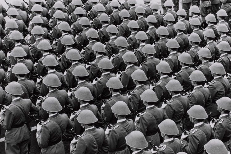 East Germany is Thirty-Two Years Old: Ceremonies commemorating the 32nd anniversary of the founding of the Democratic Republic of East Germany include a military parade. In the reviewing stand, President Erich Honecker (wearing hat, overcoat and glasses), October 8, 1981