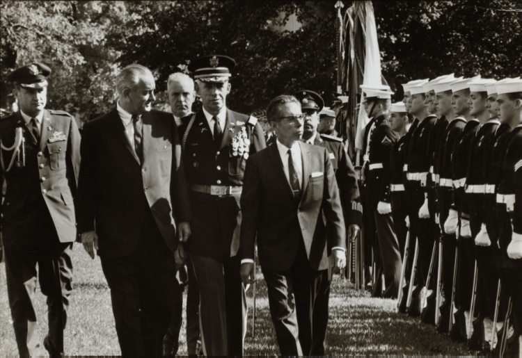 LBJ walking with Mexican President Gustavo Díaz Ordaz beside a row of Navy soldiers
