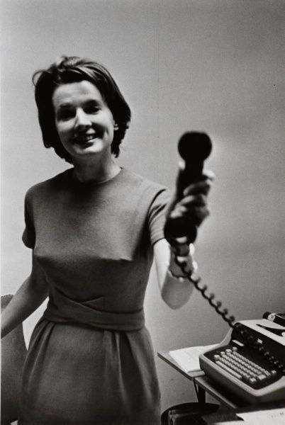 Press Secretary to the First Lady Pam Turnure holding up telephone