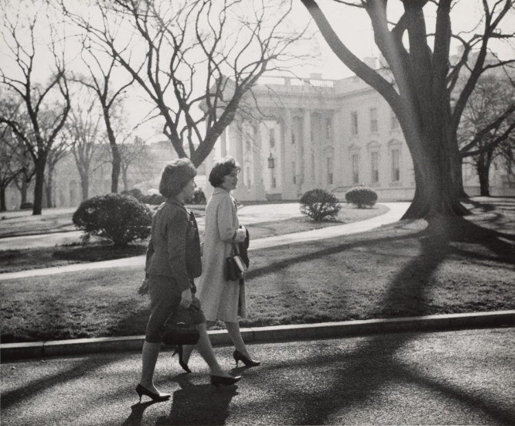Secretaries walking outside White House