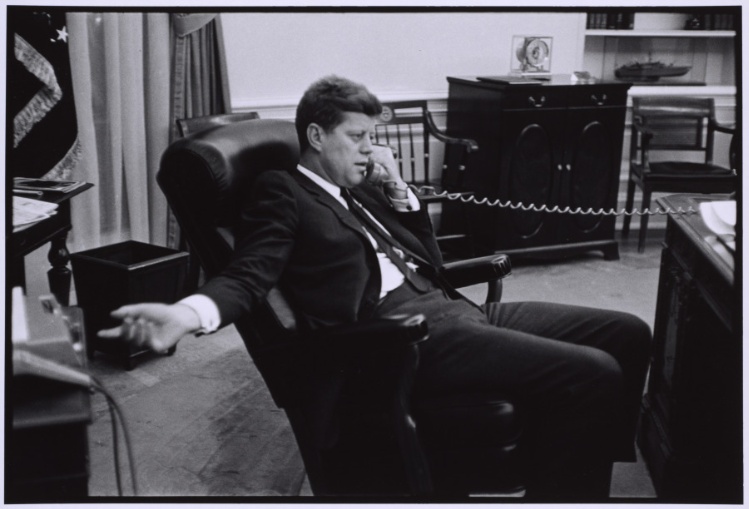 John F. Kennedy talking on phone in office