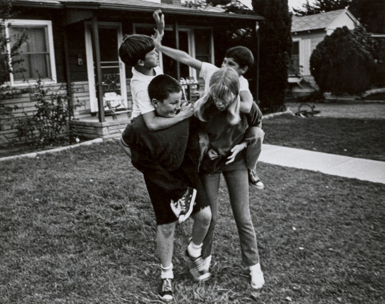 Kids playing piggyback, Tri-Valley Area, Northern California