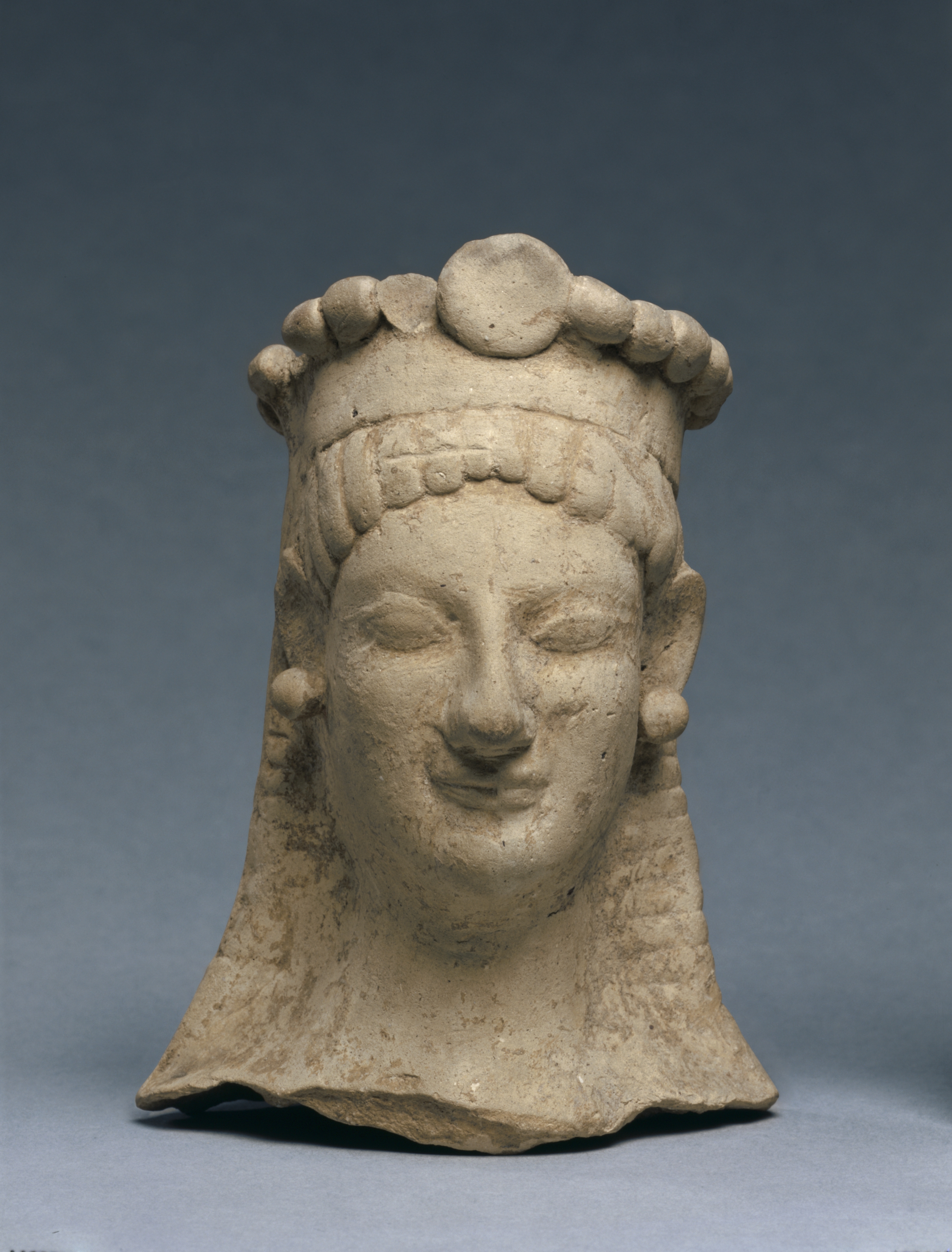 Woman's Head with Crown and Earrings
