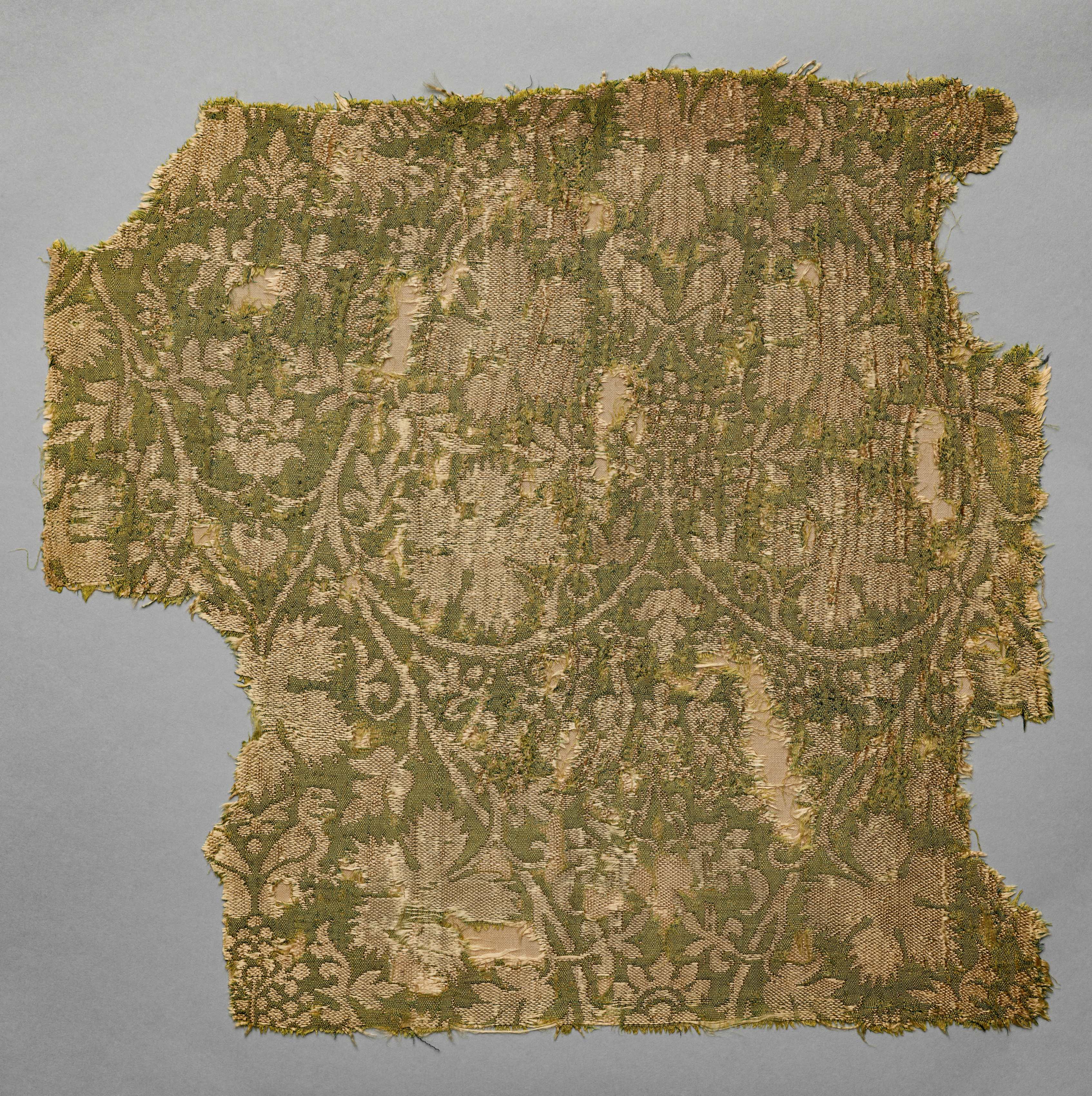 Silk fragment with scrolling vines, grape leaves, grapes, and birds