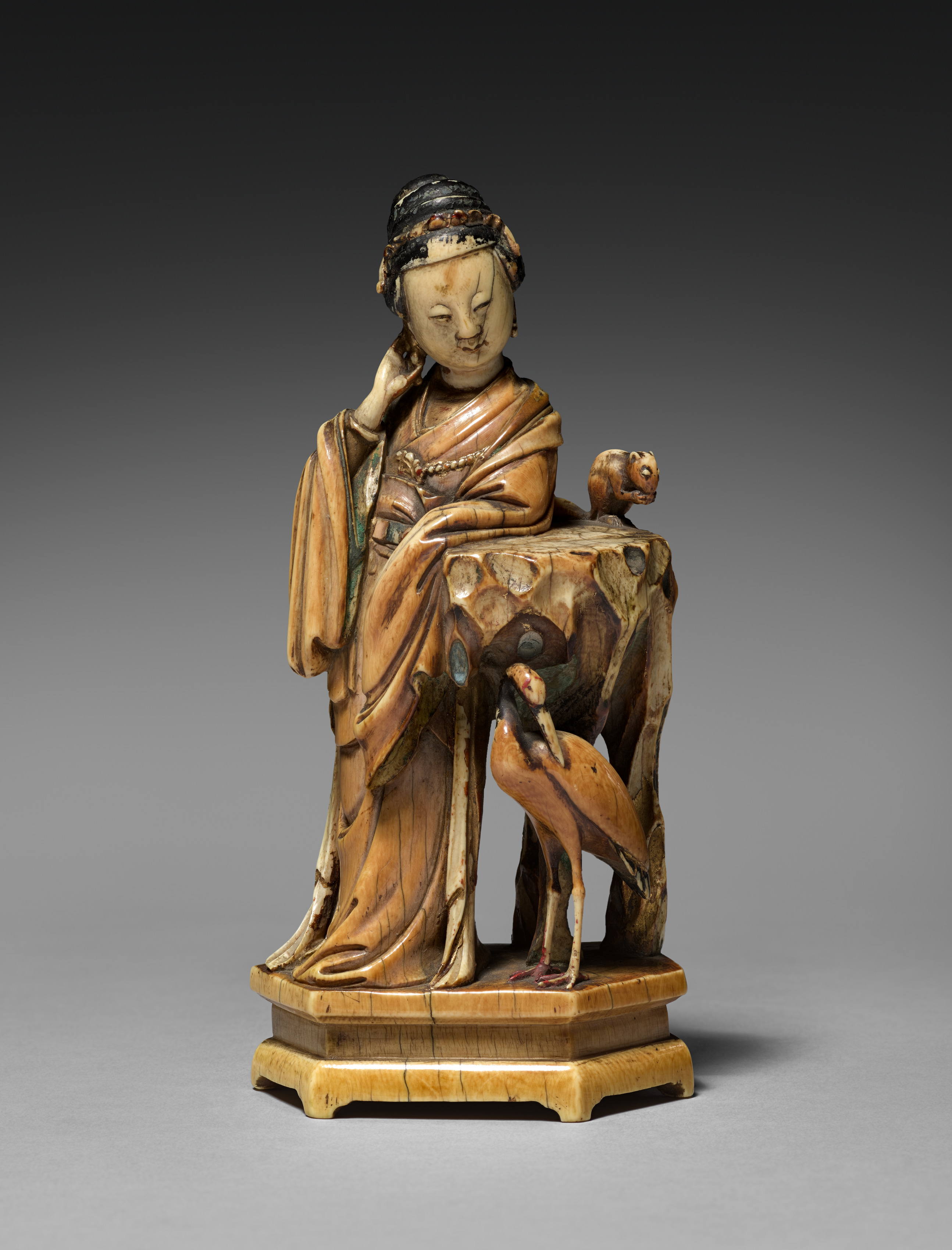 Female Figure with Crane and Squirrel