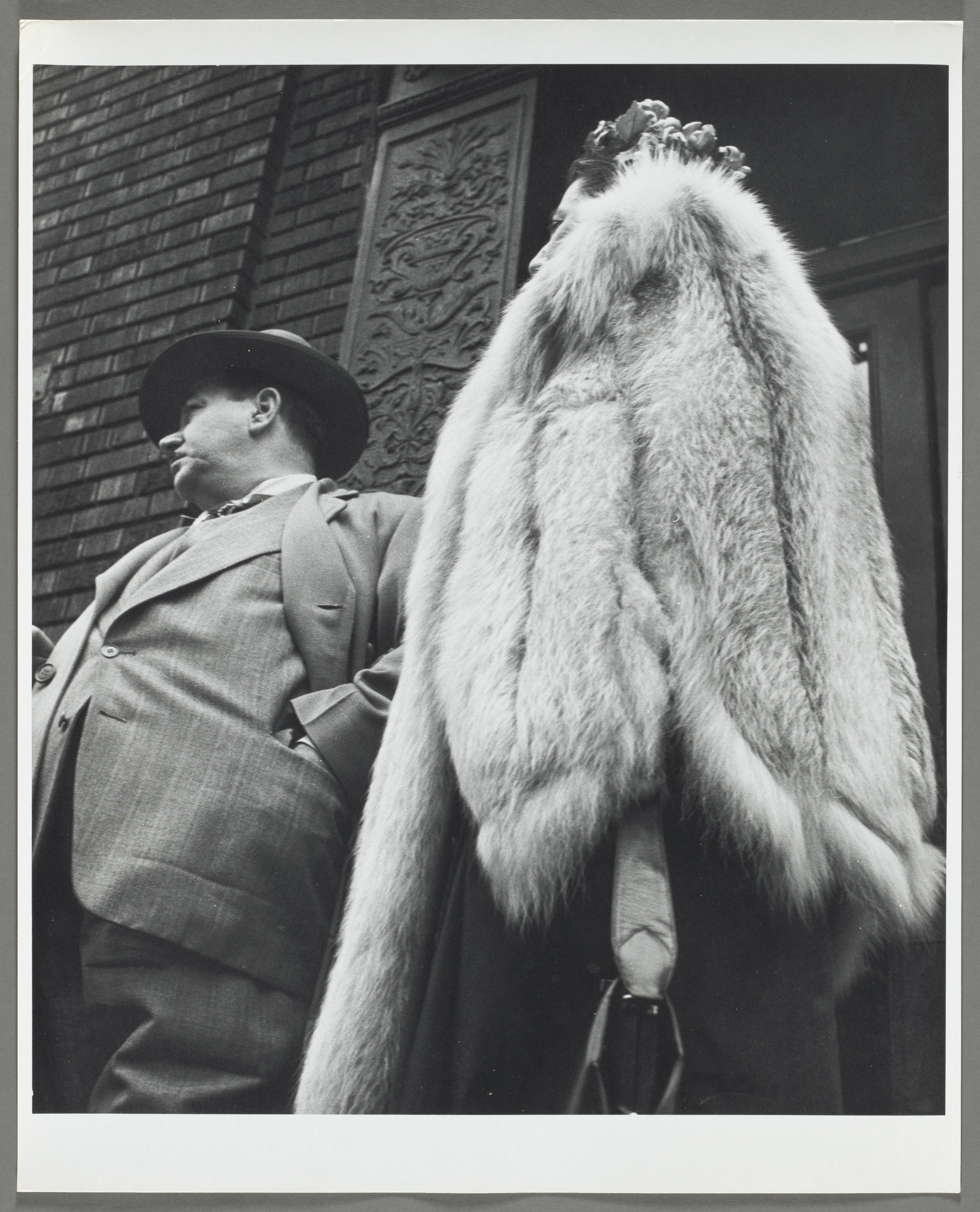 Man in Suit, Woman in Fur Coat