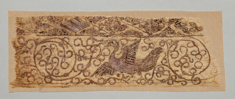 Embroidered fragment with bird among vines
