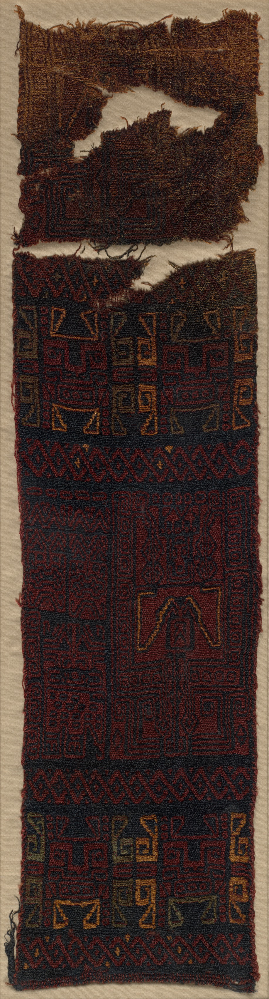 Textile Fragment with Frontal Deity Heads, Felines, and Interlace Pattern