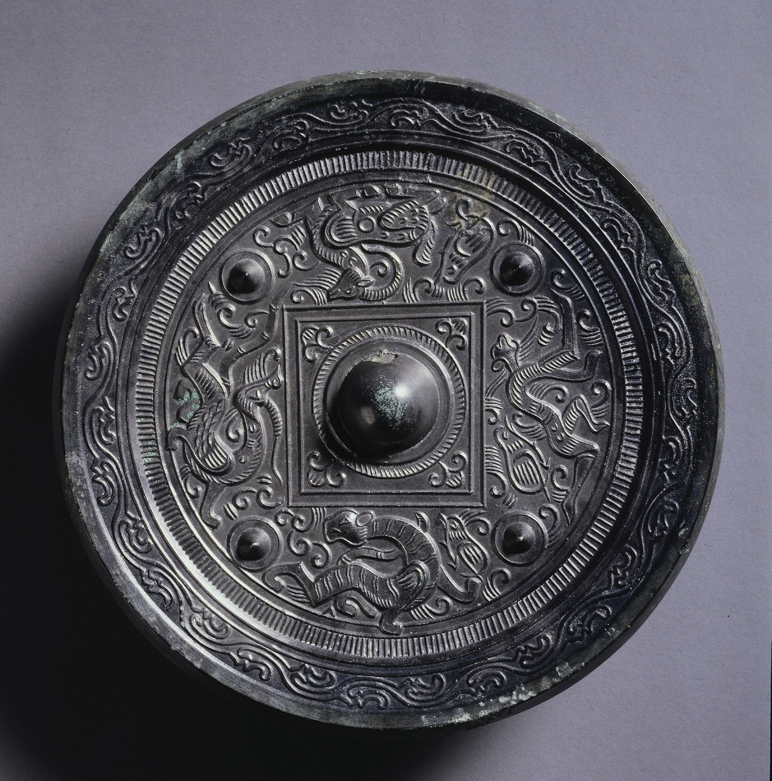 Mirror with a Central Square, an Immortal, and Auspicious Animals