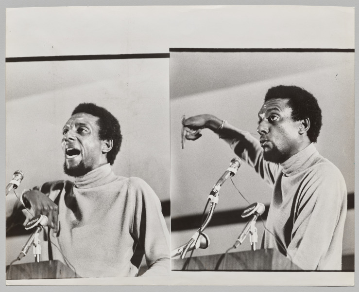 SNCC (Student Nonviolent Coordinating Committee) National Chairman Stokely Carmichael giving a passionate speech at a podium, March 1977