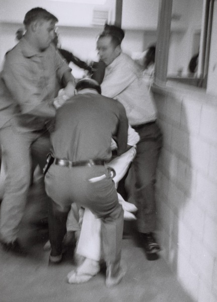 Using my presence, a prisoner tries to start some disturbance. He is subdued by a guard in the Cummins unit of Arkansas State Penitentiary, Cummins, Arkansas