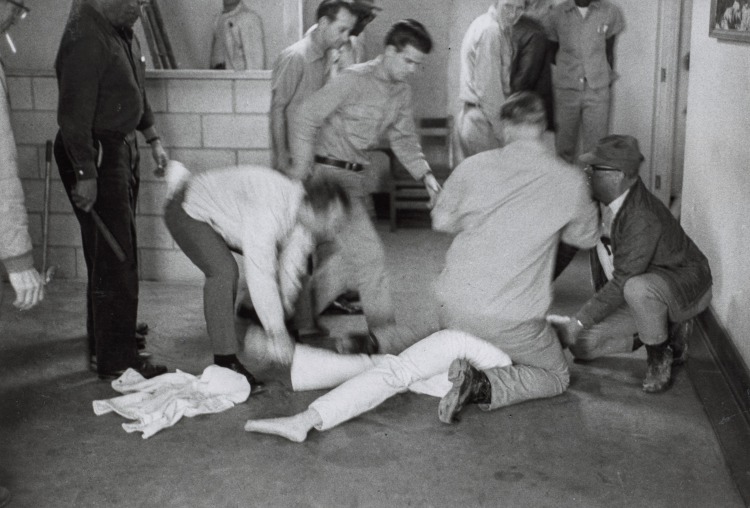 Using my presence, a prisoner tries to start some disturbance. He is subdued by a guard in the Cummins unit of Arkansas State Penitentiary, Cummins, Arkansas